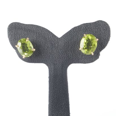Pair of gold earrings, each set with an oval-cut...