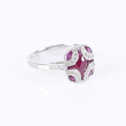 .Platinum ring set with rubies and diamonds...
