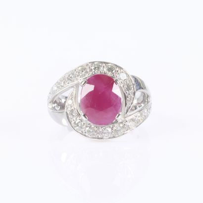 White gold ring set with an unheated oval-cut...