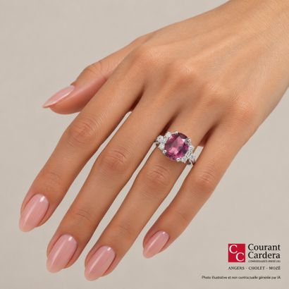 White gold ring set with an oval-cut spinel...