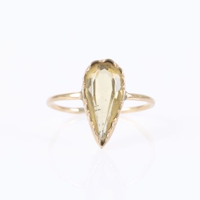 Delicate ring set with a pear-shaped citrine....