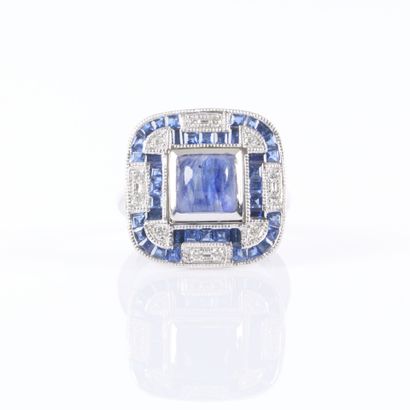 Platinum ring set with a cabochon sapphire...