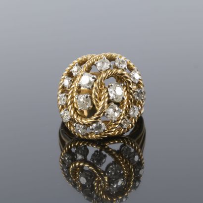 Gold and platinum ring featuring a twisted...