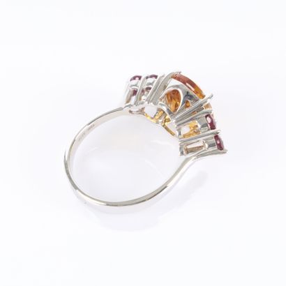 White gold ring set with an oval-cut citrine...