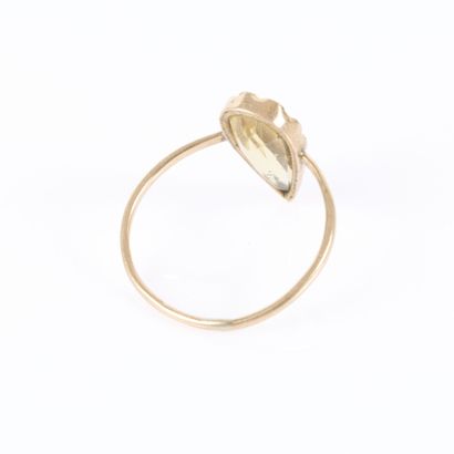 Delicate ring set with a pear-shaped citrine....