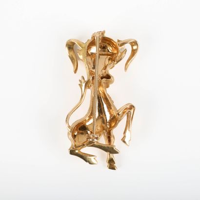 Gold brooch decorated with a bull; the necklace...
