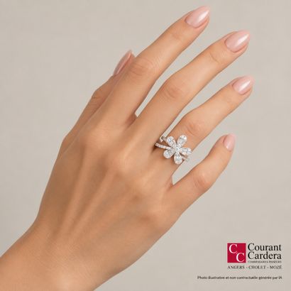 A delicate white gold ring featuring a row...