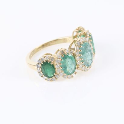 Gold ring set with a cascading row of 5 oval-cut...
