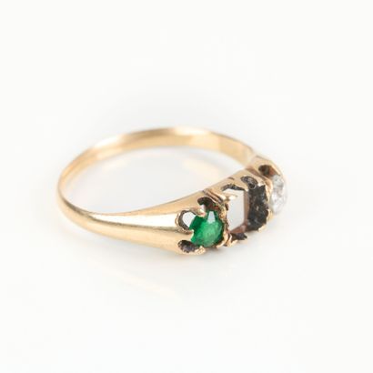 Gold ring set with an old-cut diamond weighing...
