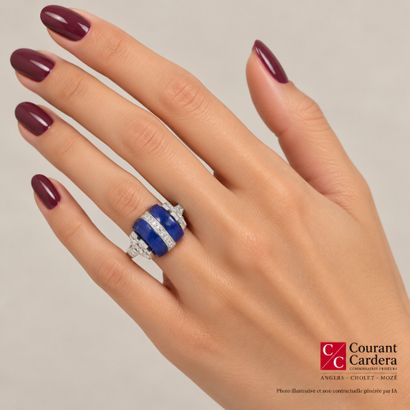 Platinum ring featuring two lapis lazuli...