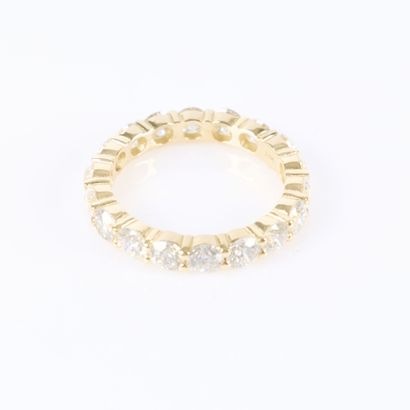 American-style gold wedding band set with...