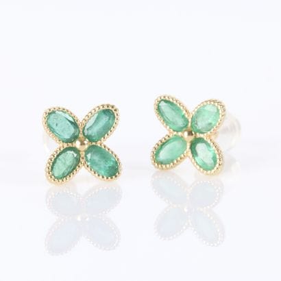 Pair of gold flower-shaped earrings, each...