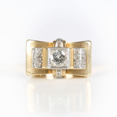 A striking tank-style ring in gold and platinum,...