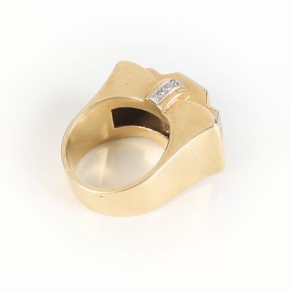 A striking tank-style ring in gold and platinum,...