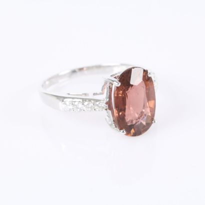 White gold ring set with an oval-cut tourmaline...