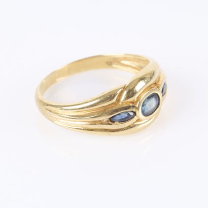 . Gold ring set with three small sapphires....