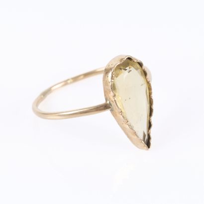 Delicate ring set with a pear-shaped citrine....
