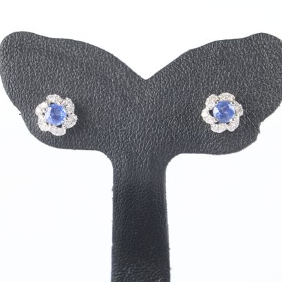 Pair of white gold earrings, each set with...