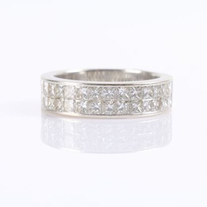 White gold ring set with princess-cut diamonds...