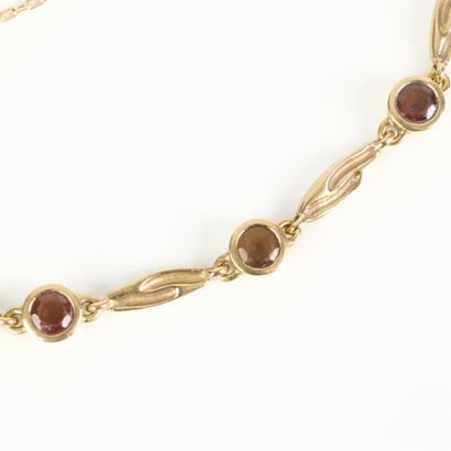 Gold bracelet set with 7 gemstones (topaz?...