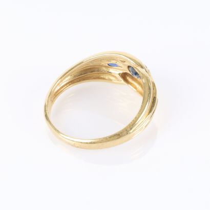 . Gold ring set with three small sapphires....
