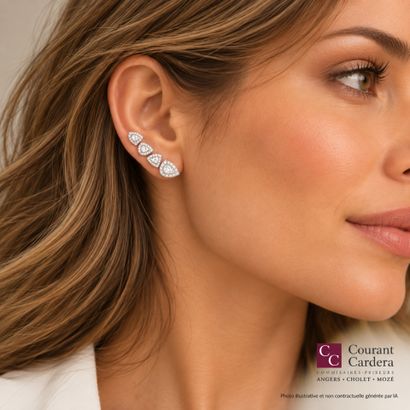 Pair of white gold earrings, each set with...