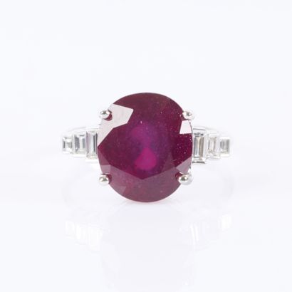 White gold ring set with a treated oval-cut...