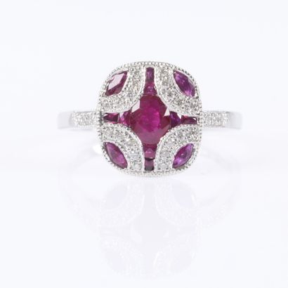 .Platinum ring set with rubies and diamonds...