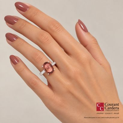 White gold ring set with an oval-cut tourmaline...