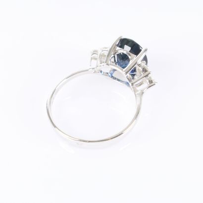 White gold ring set with an unheated oval-cut...
