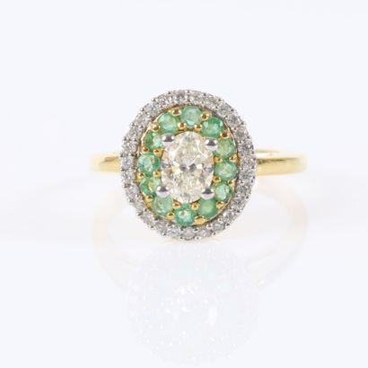 Gold ring set with an oval-cut diamond weighing...