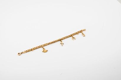 Bracelet gourmette en or jaune (750) retenant...