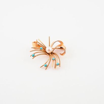 Broche noeud en or jaune (750) centrée d'une...