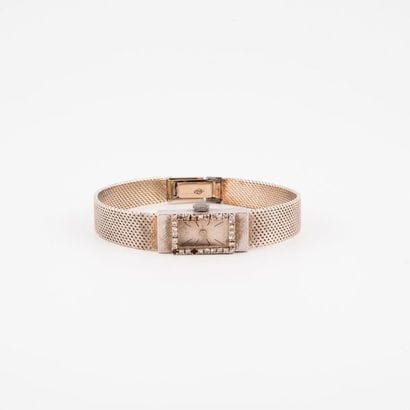 Montre bracelet de dame en or gris (750).

Boîtier...