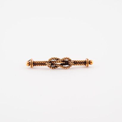 Broche noeud en or jaune (585) torsadé. 

Epingle...