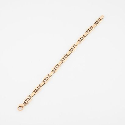 Bracelet articulé en ors jaune et gris (585)...
