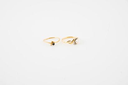 Two small yellow gold (750) rings decorated...