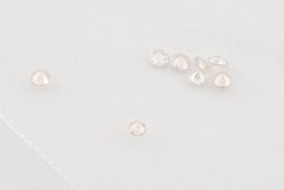 Set of eight small brilliant-cut diamonds.

Total...