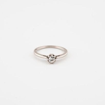 Solitaire platinum ring (850) centered with...