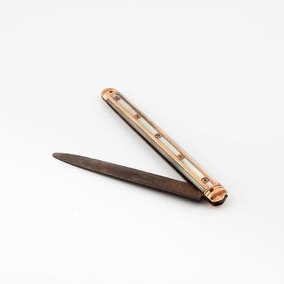 Pocket knife with steel blade.

White mother-of-pearl...