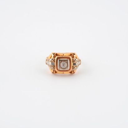 Architectural ring in yellow and white gold...
