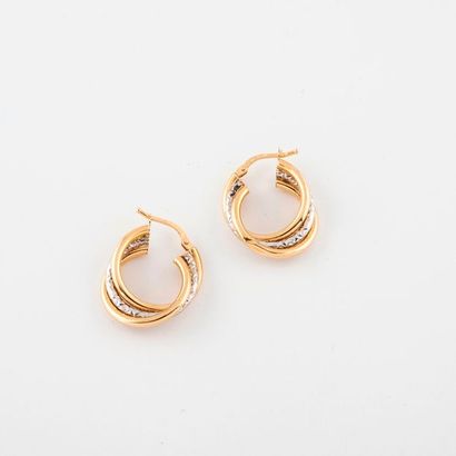 Pair of yellow and white gold creoles (750)...