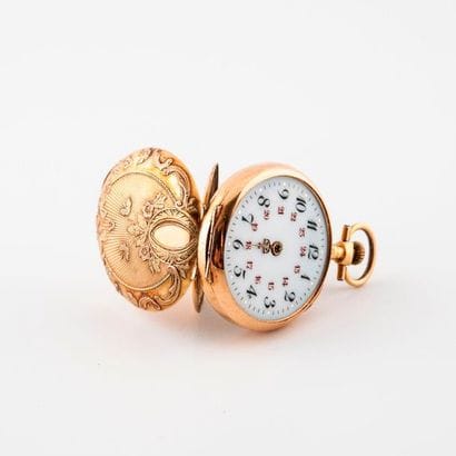 Yellow gold (750) collar watch.

Back cover...