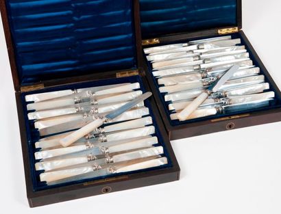 Two boxes containing two series of knives...