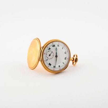 Pocket watch in yellow gold (750).

Lid with...