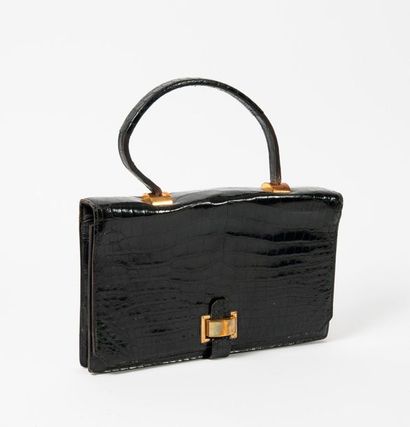 Hermès,


Sac à main en crocodile noir, un...
