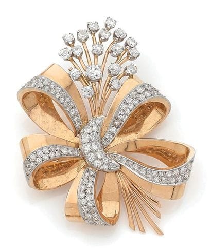 Bow brooch in yellow gold (750) and platinum...