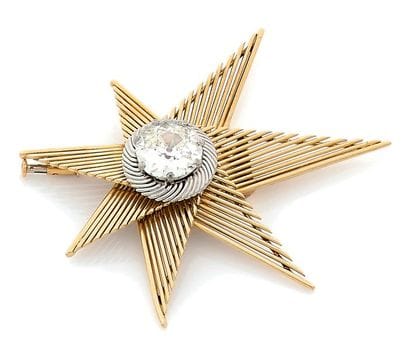 Seven-pointed star back clip in yellow gold...