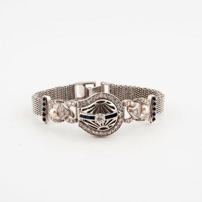 Montre bracelet de dame en or gris (750).

Boîtier...
