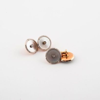 Pair of cufflinks in yellow and white gold...